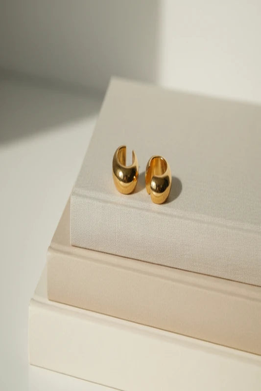 Close-up of stainless steel Cuff Joy C-shape ear cuff earrings