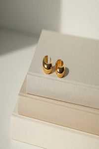 Close-up of stainless steel Cuff Joy C-shape ear cuff earrings