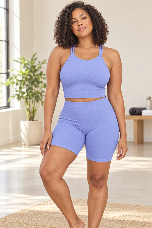 Lifestyle image of the tank set on a light-skinned Black woman